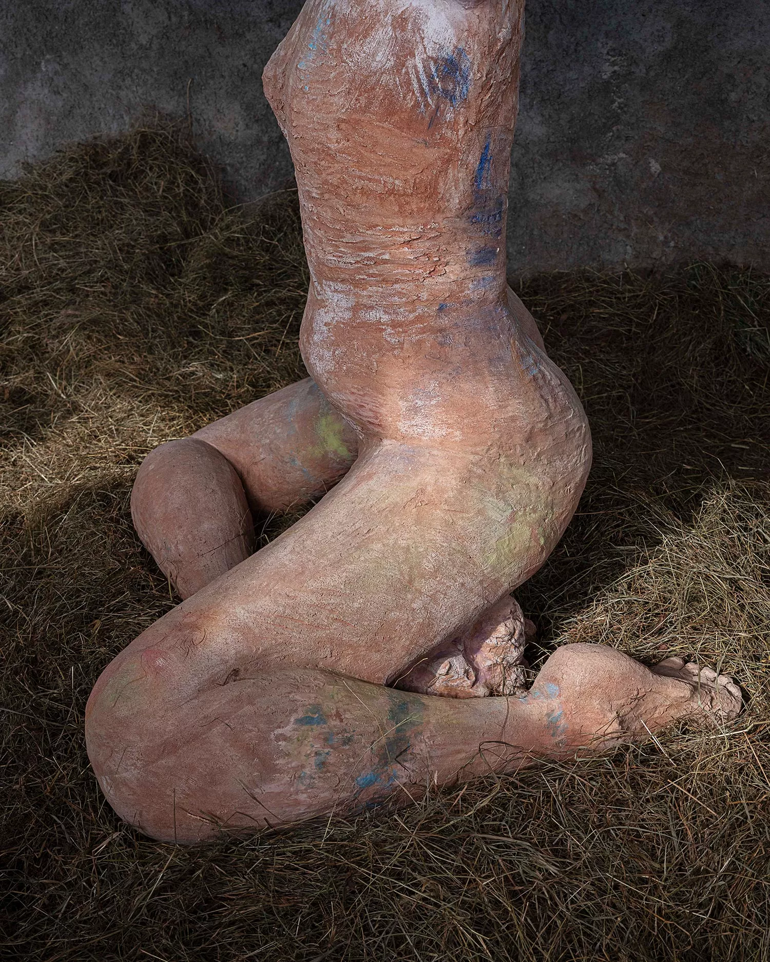 Gaia Fugazza - Gaia Fugazza, Mother of Millions, 2025, side view of the Impruneta clay sculpture, showing the torso and legs folded beneath the bo